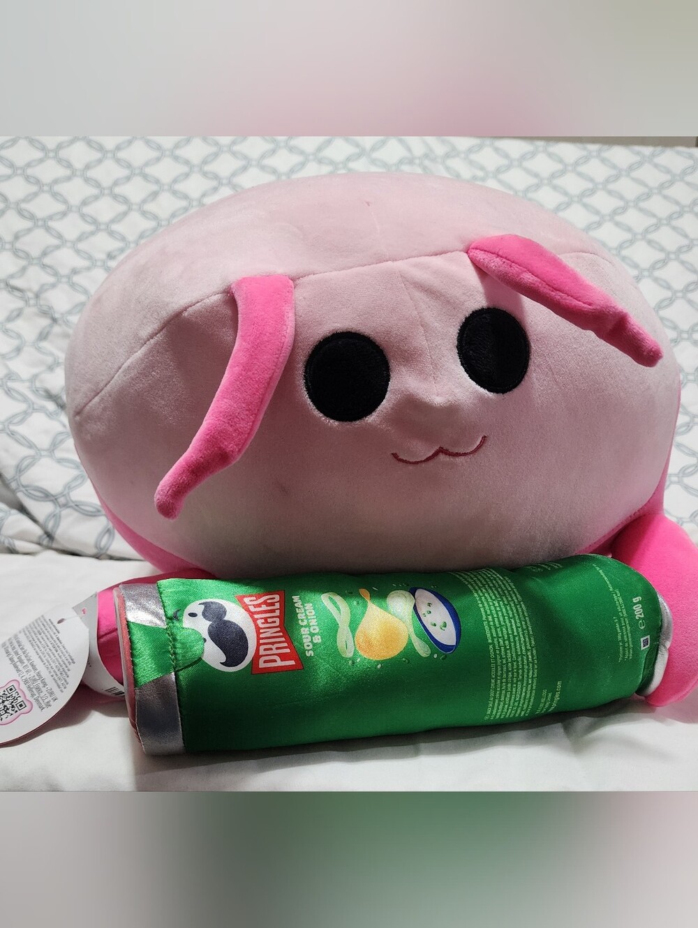 Lily the Pink Shrimp holding a Sour Cream & Onion Pringles can Plush